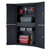 Trinity TLSPBK-0605 (36 in.) Garage Modular Cabinet in Black Shown Stacked on Top of One Another as a Modular Set with Drawers Opened Revealing Tools and Household Items.