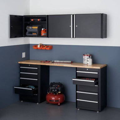 Trinity TLSPBK-0617 (6-Piece) Garage Drawer Set In Black Placed Against a Wall in a Garage With Some Cabinets and Drawers Opened.