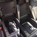 Locker Down LD2045 vehicle console safe for Ford F-150, F-250, F-350, F450 and Raptor 2015-2020  viewed from the center console safe inside the car with the gun inside on it.
